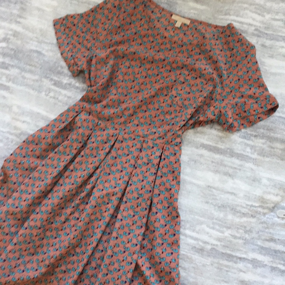 Flesh colored elephant print dress above the knee